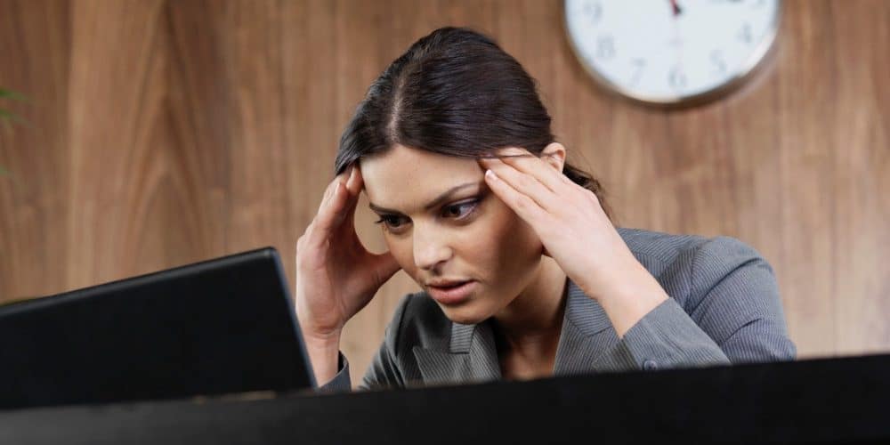 business woman frustrated computer featured