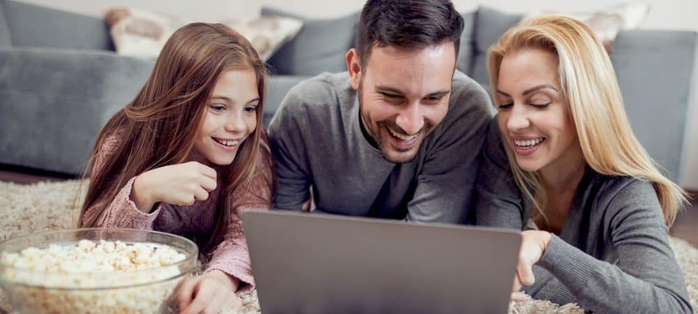 family watching movie computer popcorn featured