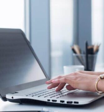 woman writing computer featured 1000x450